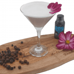Violette Gin Fizz made with Heart of Scotland Gin in a martini glass, garnished with an edible violet.