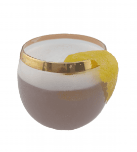Violette Gin Fizz made with Heart of Scotland Gin in a half ball glass, garnished with an lemmon swirl